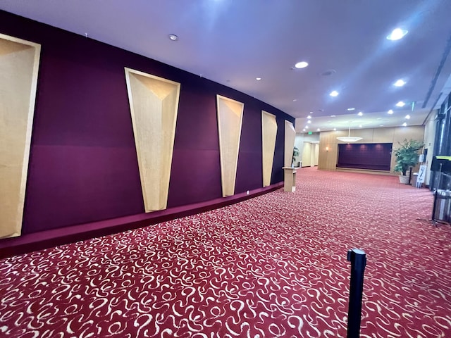 corridor featuring recessed lighting and carpet