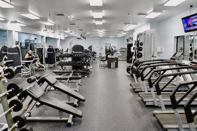 workout area with ceiling fan and visible vents