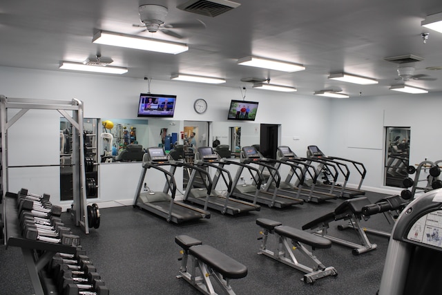 workout area featuring baseboards, visible vents, and a ceiling fan