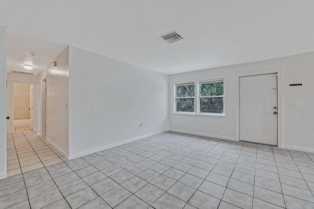 empty room with light tile patterned flooring