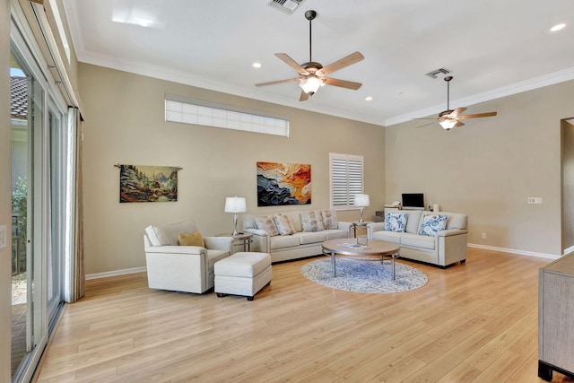 living room with crown molding, recessed lighting, light wood finished floors, and baseboards