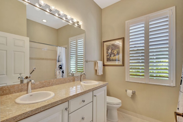 bathroom featuring a sink, tile patterned flooring, double vanity, and a shower with shower curtain