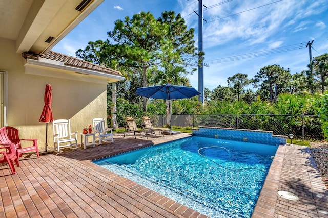 view of swimming pool with fence, a patio area, and a fenced in pool