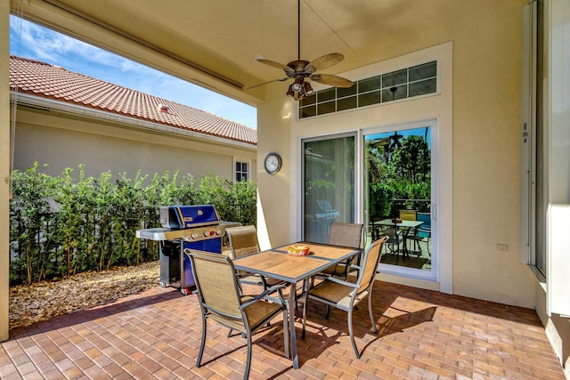 view of patio / terrace featuring ceiling fan, grilling area, and outdoor dining area