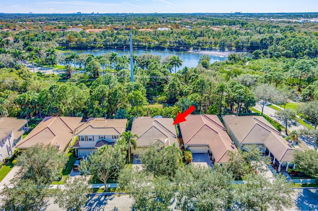 drone / aerial view with a water view and a residential view