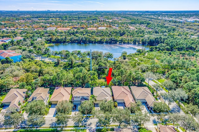 birds eye view of property featuring a water view and a residential view