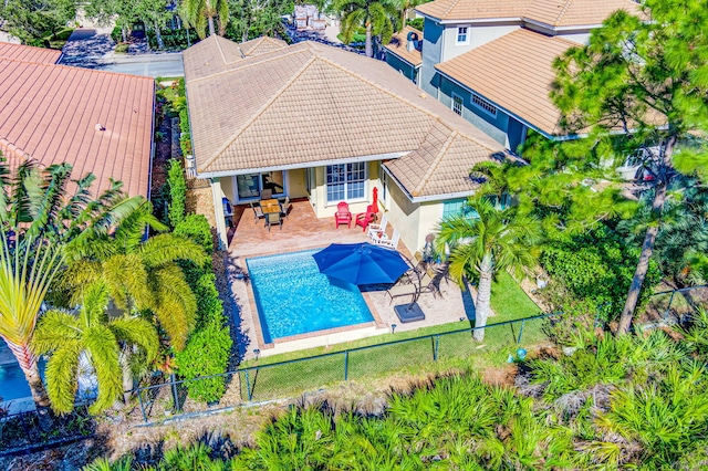 view of pool with a fenced in pool, a fenced backyard, and a patio