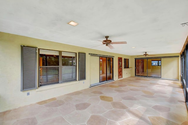 view of patio featuring a ceiling fan