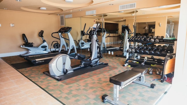 workout area with visible vents and tile patterned floors