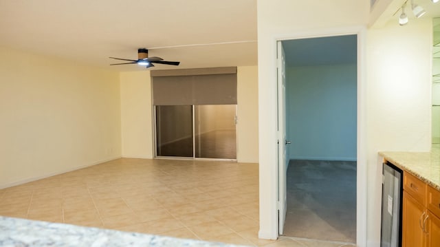 interior space with wine cooler, ceiling fan, and vanity