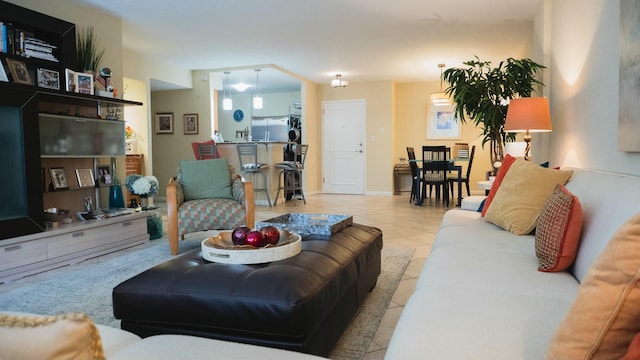 living area featuring light tile patterned flooring