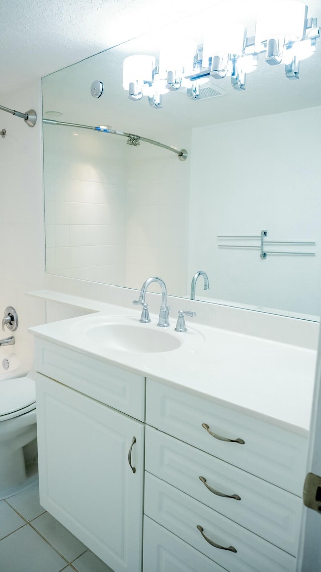 full bathroom featuring vanity, bathing tub / shower combination, tile patterned flooring, and toilet