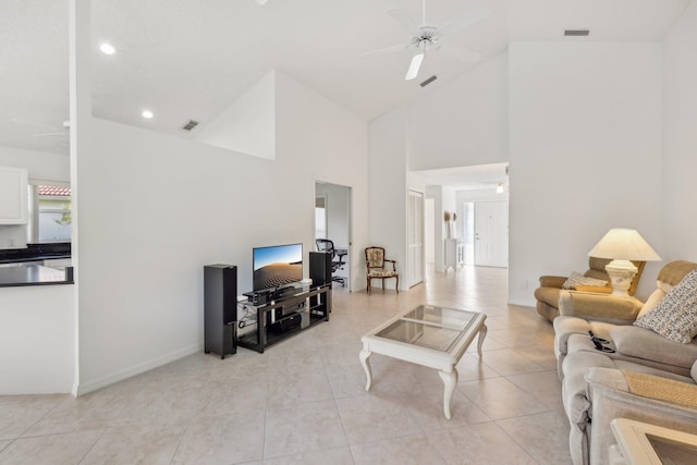 living room with a ceiling fan, visible vents, and light tile patterned floors