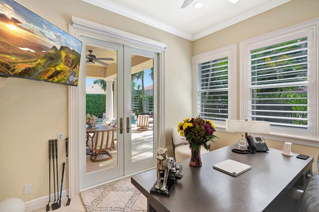 tiled dining room with a chandelier, a high ceiling, and baseboards