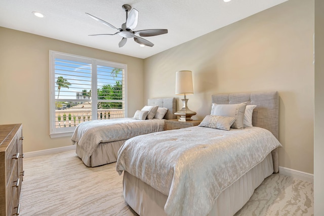 bedroom featuring recessed lighting, light colored carpet, ceiling fan, and baseboards