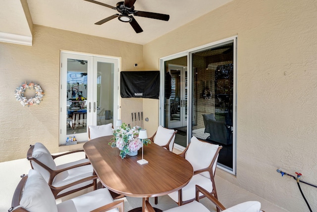 view of patio with ceiling fan, french doors, and outdoor dining space