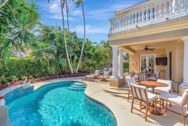 view of patio featuring fence and a fenced in pool