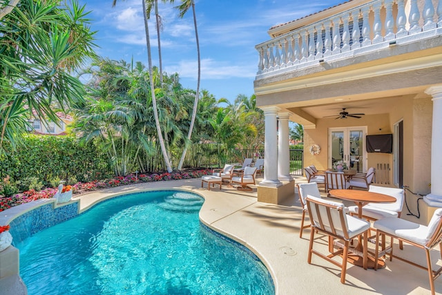 view of pool with a fenced in pool, a ceiling fan, a patio, fence, and french doors