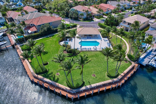 drone / aerial view with a residential view and a water view