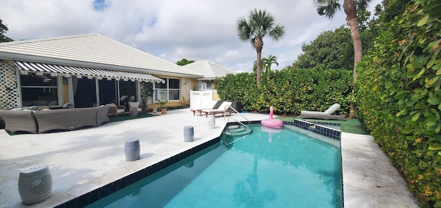 view of swimming pool featuring an outdoor hangout area, a patio, and a fenced in pool