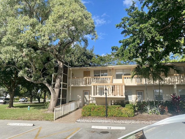 view of property with uncovered parking