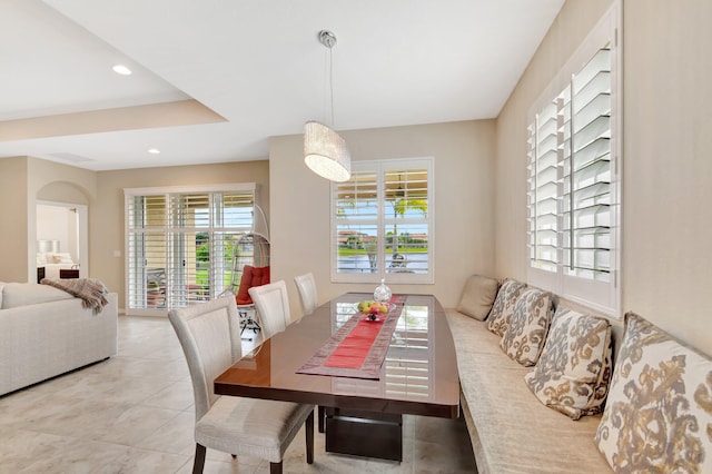 dining space with light tile patterned floors and recessed lighting