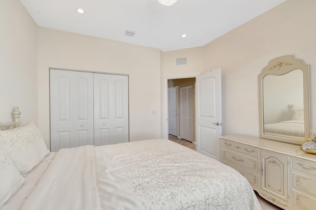 bedroom featuring recessed lighting, a closet, and visible vents