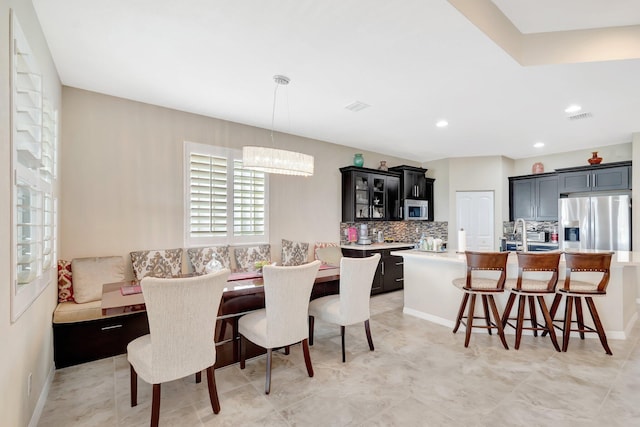 dining space with recessed lighting and visible vents