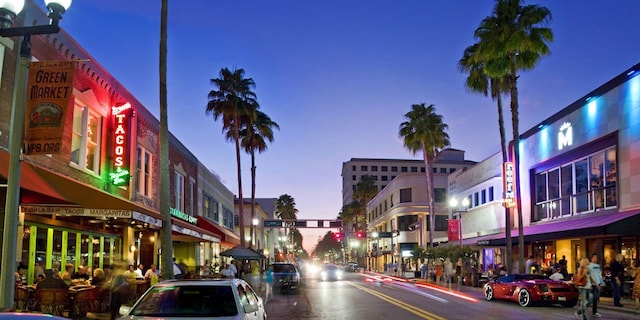 view of road featuring curbs, street lighting, and sidewalks