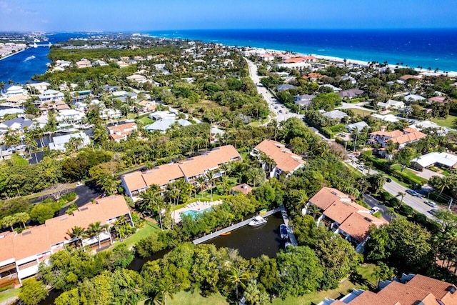 birds eye view of property with a water view and a residential view