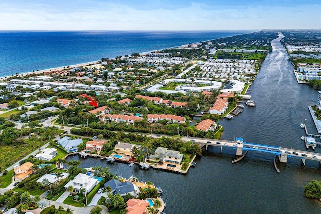 bird's eye view featuring a water view and a residential view