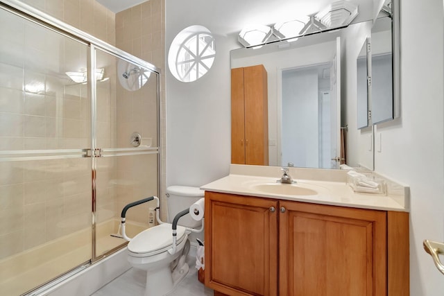 full bathroom featuring a stall shower, vanity, and toilet