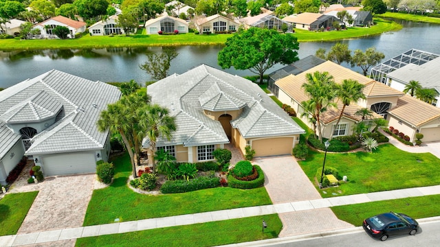 aerial view with a residential view and a water view
