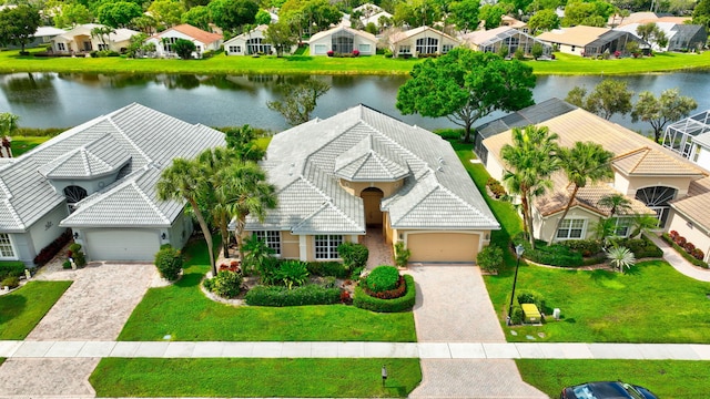 aerial view featuring a water view and a residential view
