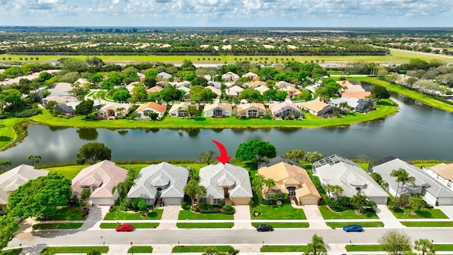 aerial view featuring a water view and a residential view