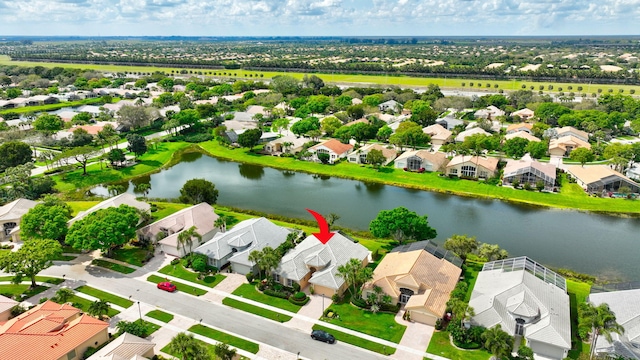 bird's eye view with a residential view and a water view