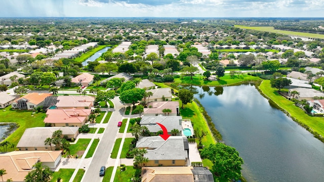 aerial view with a residential view and a water view