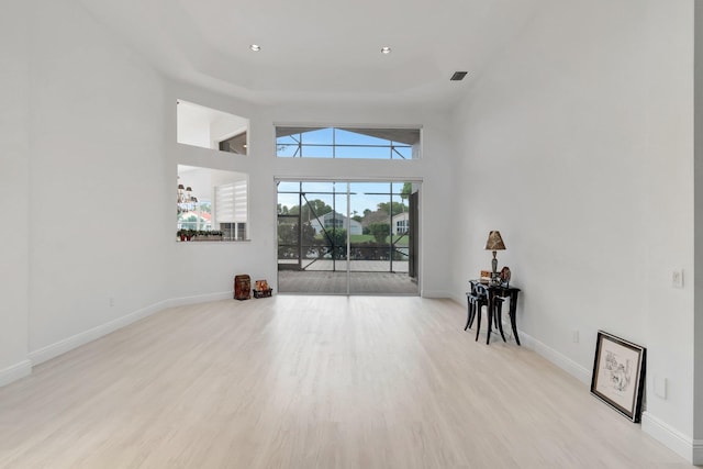 living room with light wood-type flooring and baseboards