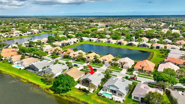 birds eye view of property with a residential view and a water view