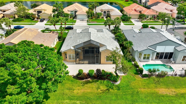 bird's eye view with a residential view and a water view