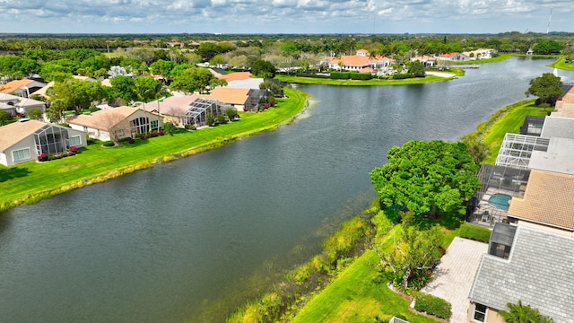 drone / aerial view featuring a water view and a residential view