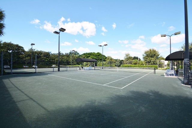 view of sport court with fence