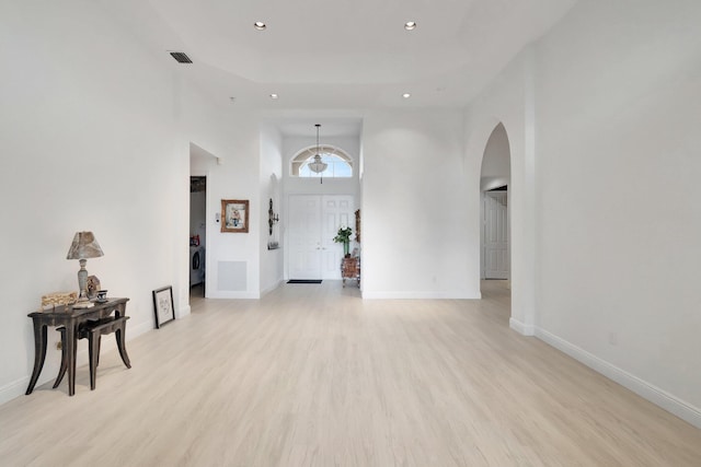 entrance foyer featuring light wood finished floors, baseboards, visible vents, and recessed lighting