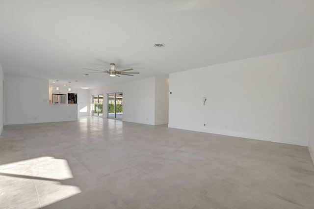 unfurnished living room featuring baseboards, visible vents, and a ceiling fan