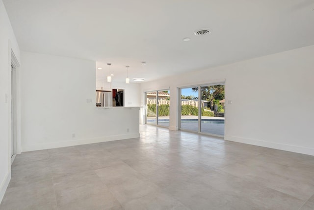 unfurnished room with recessed lighting, visible vents, and baseboards