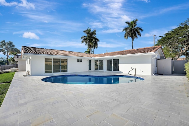 view of pool with a fenced in pool, a patio area, and fence