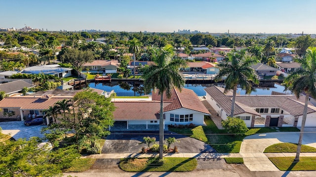 aerial view with a water view and a residential view