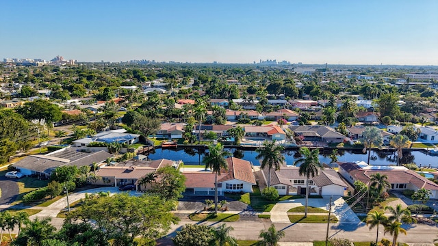 birds eye view of property with a water view and a residential view