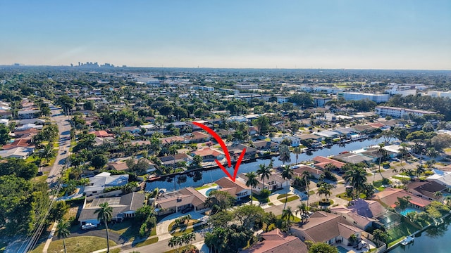 birds eye view of property featuring a residential view and a water view