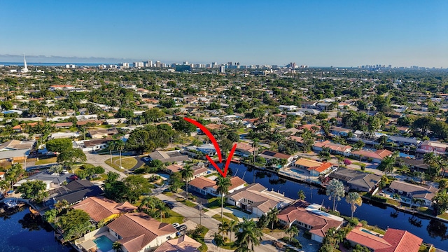 birds eye view of property featuring a water view and a residential view